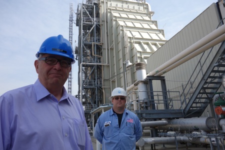 Fred Fletcher (left), former general manager of the Magnolia Power Project, stands with another worker at the natural gas-fired power plant in Burbank.