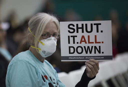 Matt Pakucko, president of Save Porter Ranch, uses a bullhorn to disrupt and take over a meeting of state regulators in February 2017