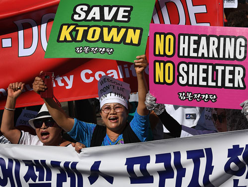 Members of the local Korean community protest against a proposal to construct a temporary homeless shelter in Koreatown on June 3, 2018.