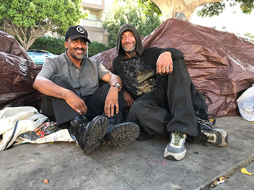Shawn Pleasants, and his friend, Junior, by their tents on Hobart Street in Koreatown.