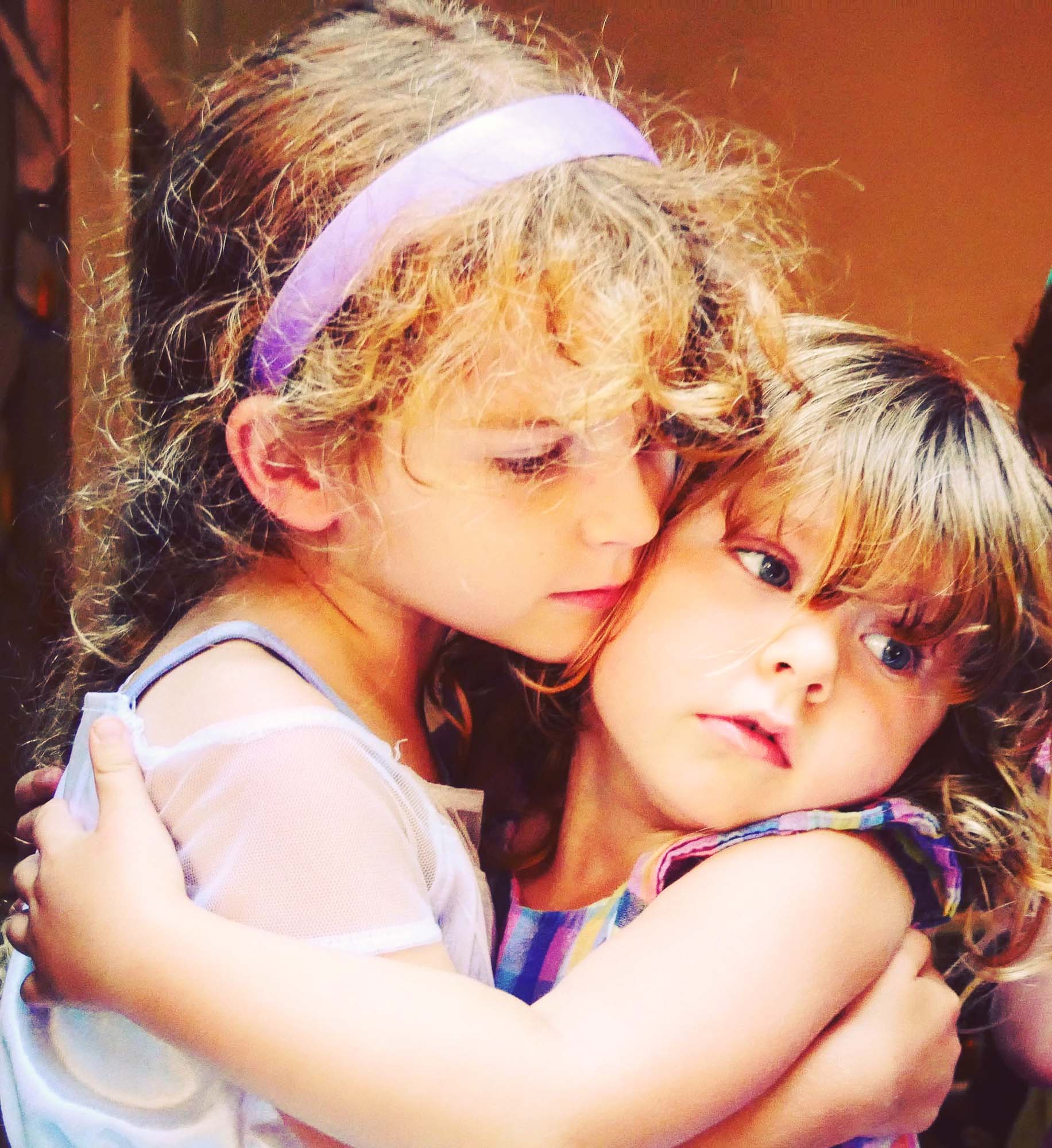 Adair Angel giving Elisabeth Angel a big sister hug.