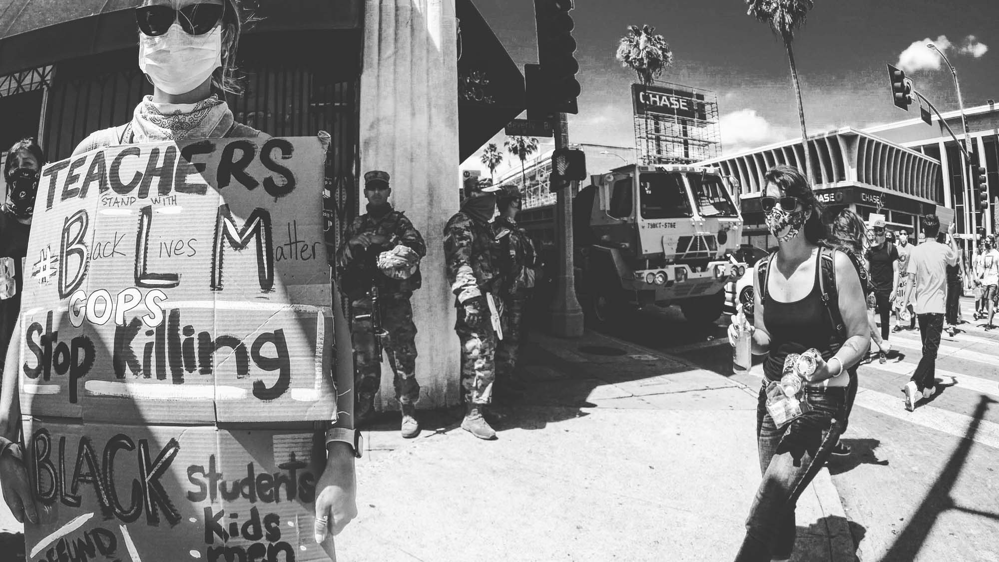 Protests signs, the National Guard, armored military vehicles and a woman walking around with hand sanitizer. This was easily the most sanitary protest in history.