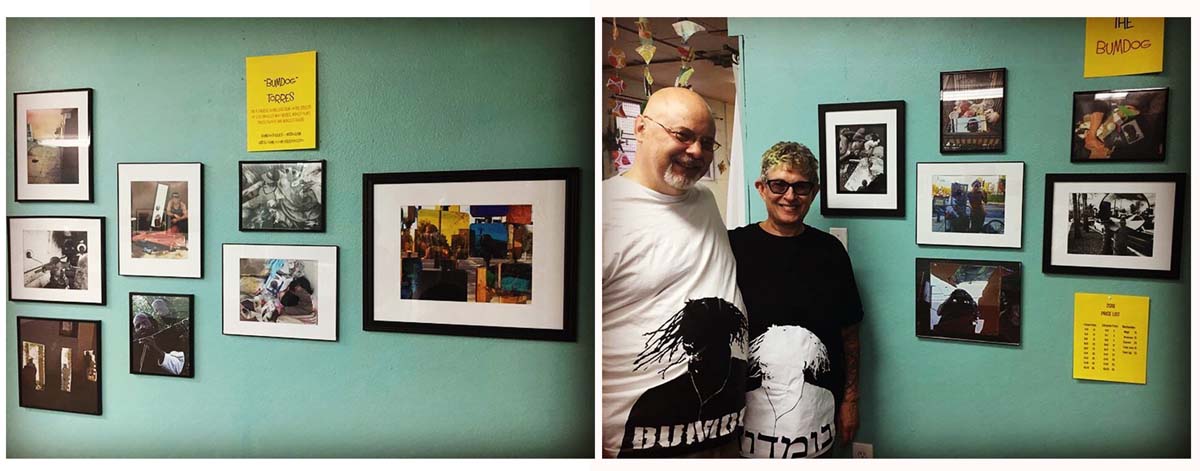 Bill Miller and Naomi Jacobi Reyerson stand with my photographs displayed on the walls behind them in the Wandering Art Gallery in Denver, Colo. Both are wearing Bumdog T-shirts.