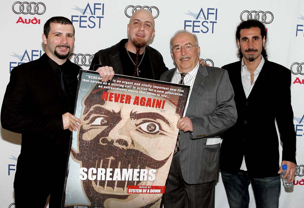 Musicians John Dolmayan, Shavo Odadjian, grandfather Markharout and Serj Tankian arrives at the world premiere of 