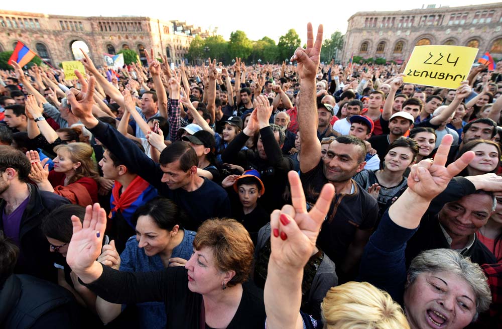 Supporters of Armenia's opposition leader Nikol Pashinyan attend a rally in downtown Yerevan on April 26, 2018.