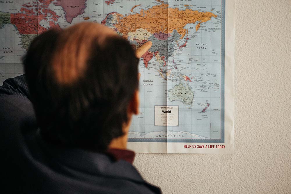Erkin Sidick points out Xinjiang on a map in his home in Santa Clarita.