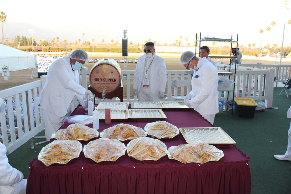 La Luz Del Mundo members prepare the Holy Supper in February in Pomona. The ritual typically involves thousands of people all drinking out of the same goblet, but because of coronavirus, individual cups were used for the first time ever this year.