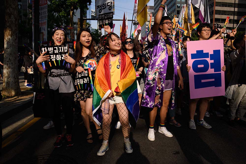 Participants march during a Pride event in support of LGBT rights in Seoul on June 1, 2019.