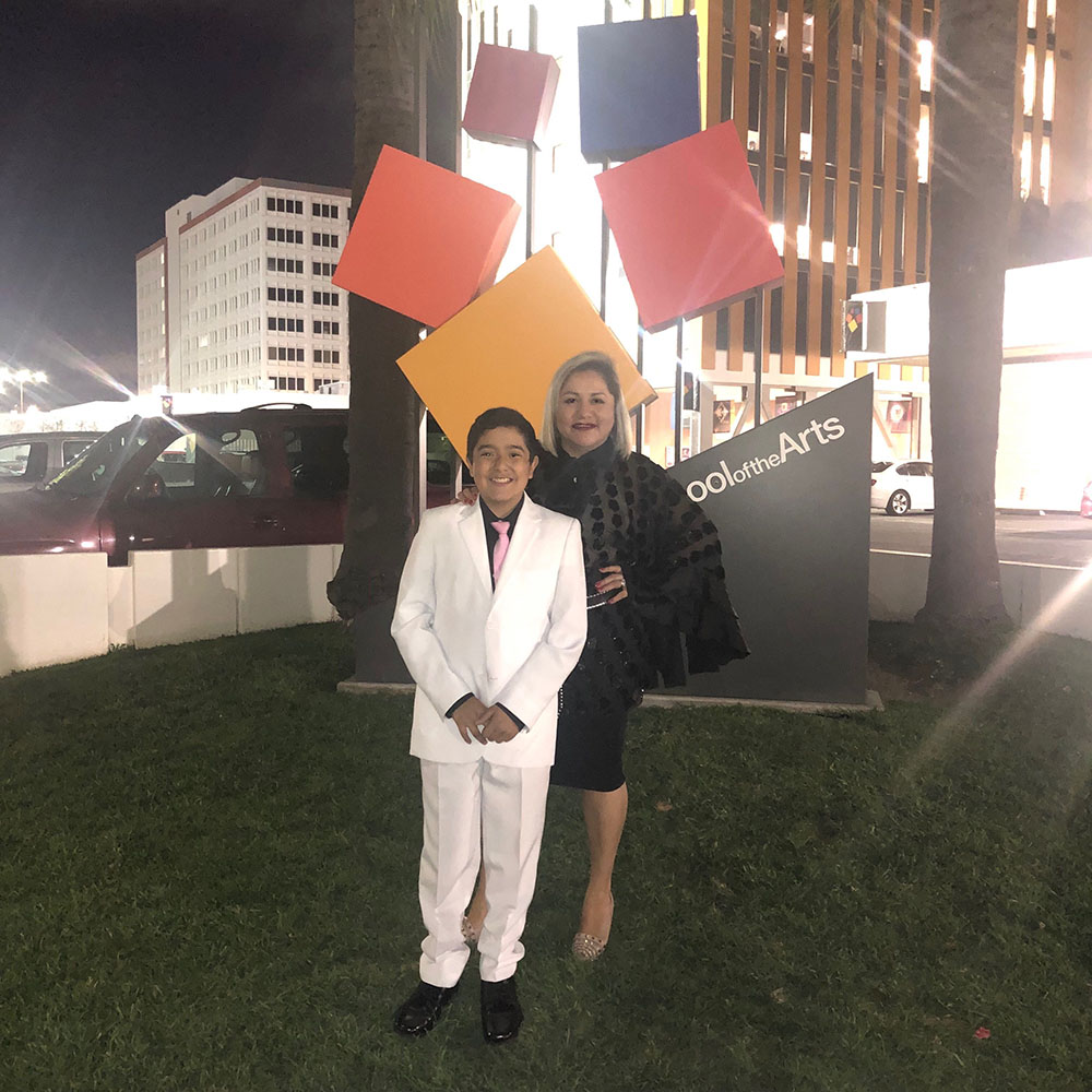  Aiden Roman poses with his mom, Veronica, in front of the Orange County School of the Arts. Aiden is trying for a third time to get a coveted spot at the popular arts school.