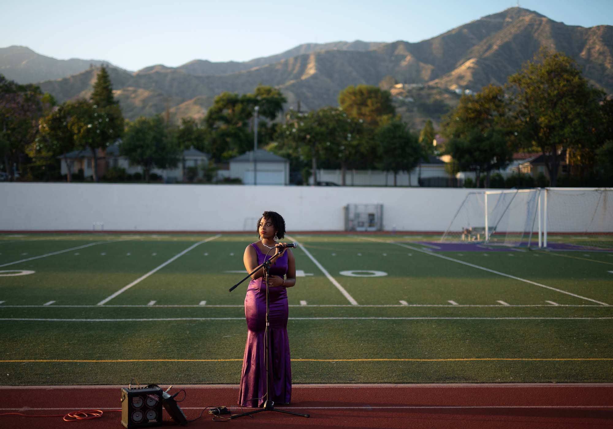 Katrina Manor, pictured in the Glendale's Hoover High School stadium, where she would have sung during graduation ceremonies. She explained that having the end of her senior year derailed has been flush with emotion.