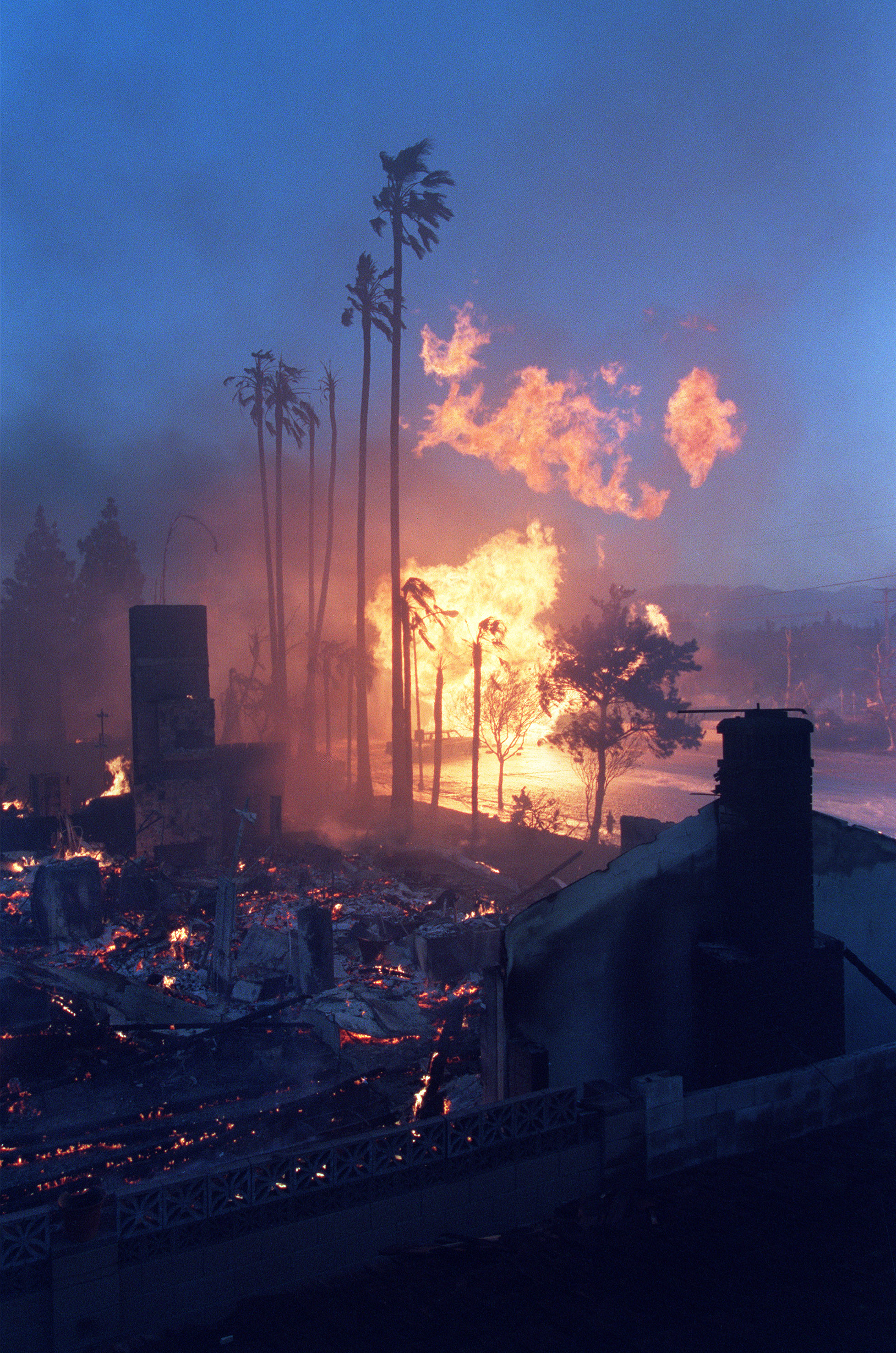 A gas main on fire throws flames into the air after it broke and exploded, destroying nearby homes following the Northridge earthquake. A total of 466 fires were reported on Jan. 17, 1994, three of which simultaneously broke out immediately following the earthquake and were due of the rupture of natural gas valve/mains.